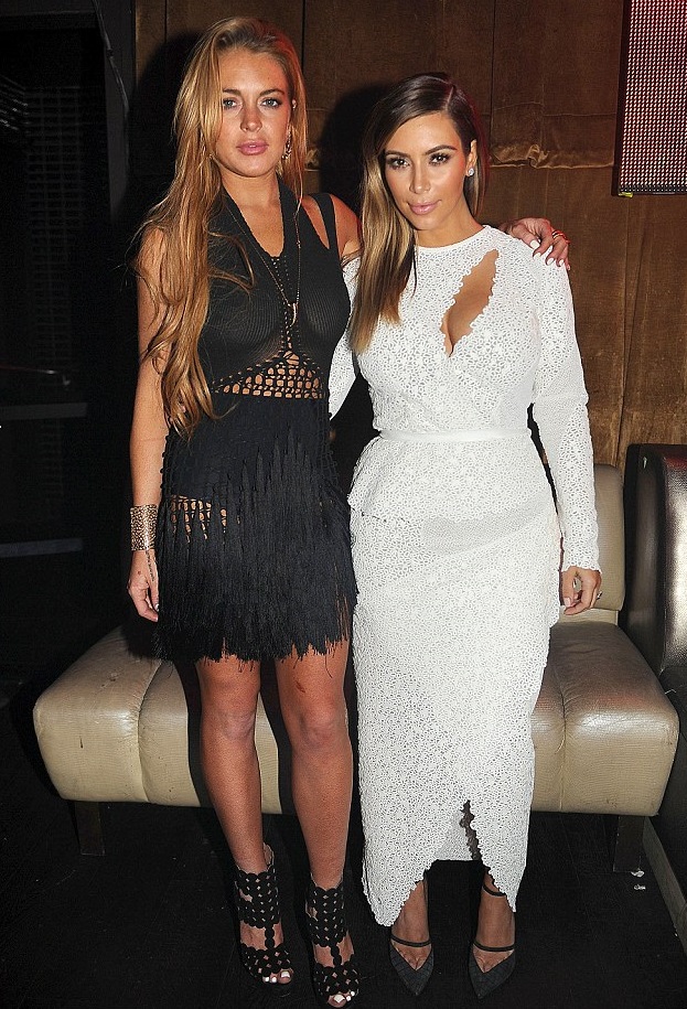 Kim-Kardashians-Art-Basel-Miami-Proenza-Schouler-Appliquéd-White-Lace-Cut-Out-Gown-+-Lindsay-Lohans-Mark-Fast-Black-Knit-Dress-and-Azzedina-Alaia-Black-Circle-Sandals