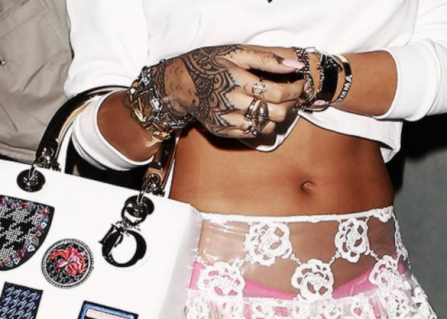 Rihanna carries a 'Lady Dior' box tote and wears a Jennifer Fisher White Diamond Cuff.