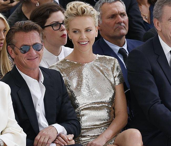 Sean Penn and Charlize Theron at the Dior Haute Couture show in Paris