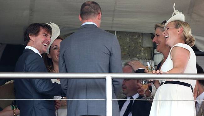 Tom Cruise shares a laugh with Zara Phillips in the UK