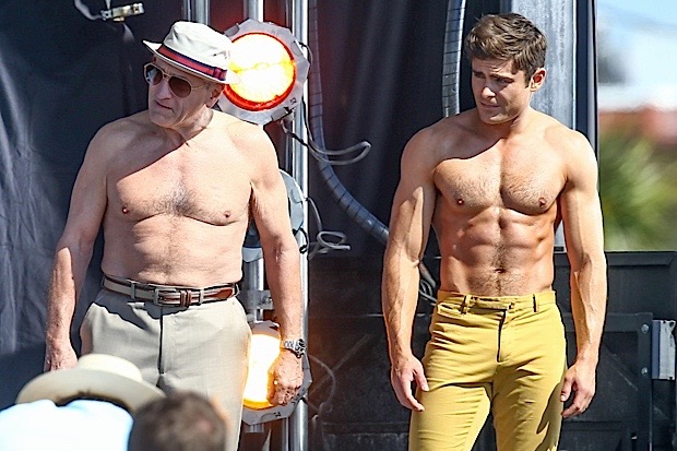 51726116 Actors Zac Efron and Robert De Niro take off their shirts for a "Flex Off" contest for a scene in their new movie "Dirty Grandpa" on April 30, 2015 in Tybee Island, Georgia. The new comedy tells the story of an uptight guy who is tricked into driving his grandfather, a perverted former Army general, to Florida for spring break. FameFlynet, Inc - Beverly Hills, CA, USA - +1 (818) 307-4813